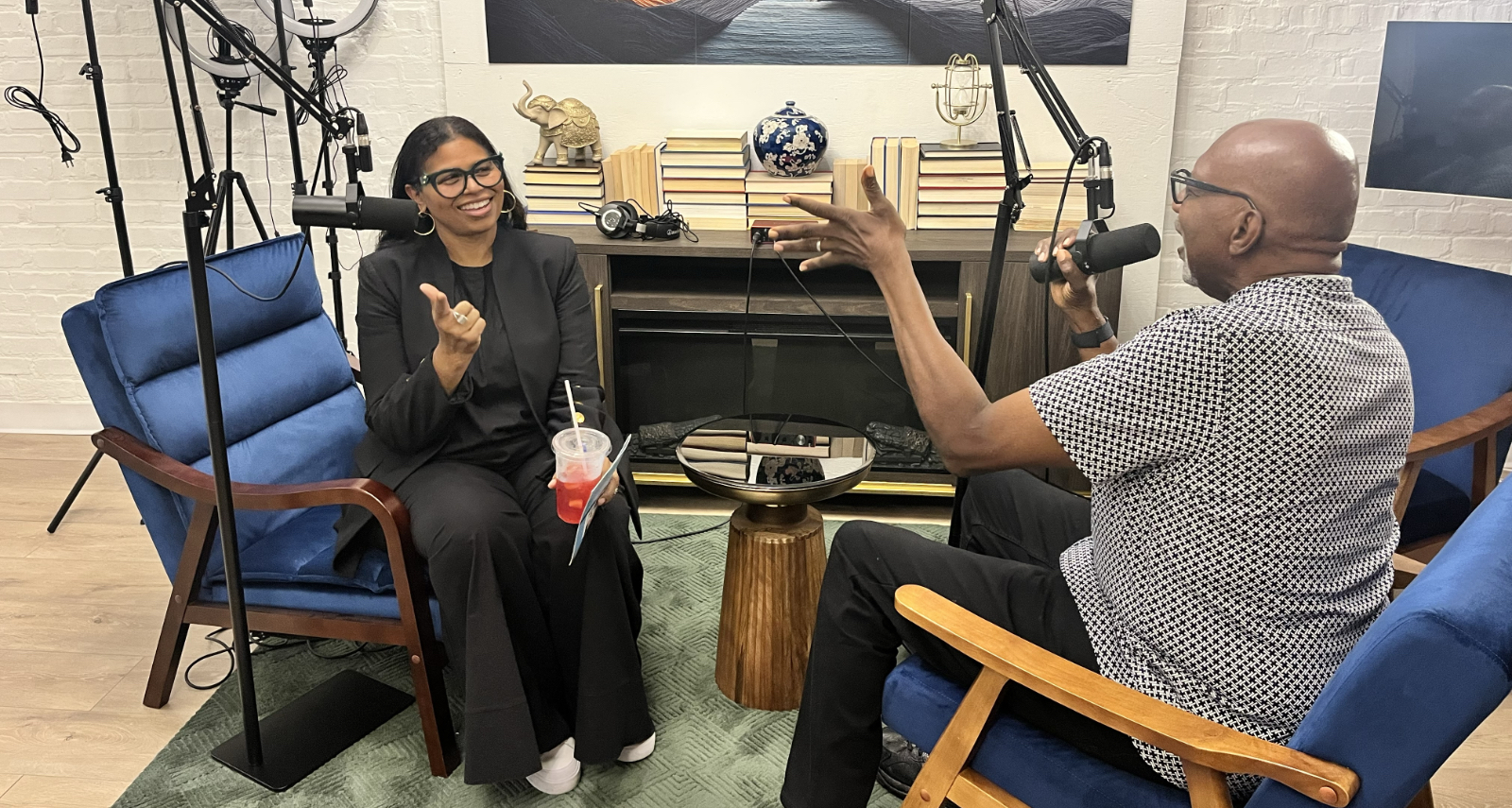 The owner of Beyond The Book and a guest sitting in the podcast studio space.